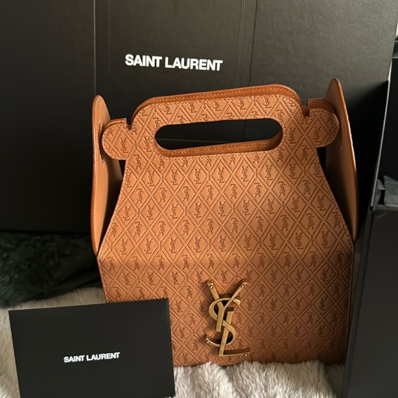 YVES SAINT LAURENT. - Sold - Picture 1 of 6